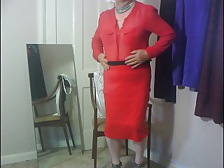 Dee wearing red skirt and blouse