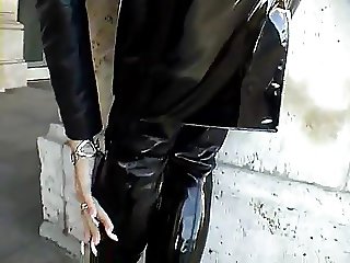Sexy blonde lady black wet-look-outfit