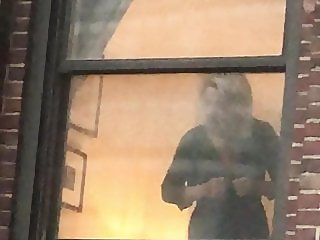 NYC hotel window voyeur mature blonde dressing