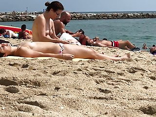 Topless teen on Barcelona beach