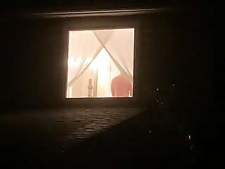 Voyeur watches sexy neighbor through window 2