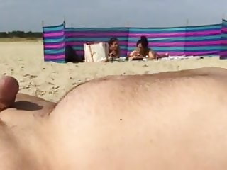 Cumming on beach, voyeur