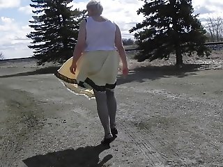 Sissy Ray in Gold Dress Outdoors in Roadside Rest Area