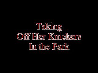 Taking off her knickers in the park