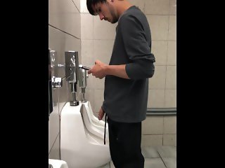 big dick at urinal on phone