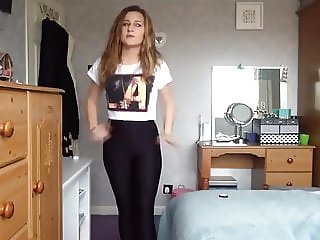 Sexy girl tries on tight and shiny lycra spandex leggings