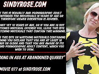 Sindy Rose has a white dong in her ass in an abandoned quarry